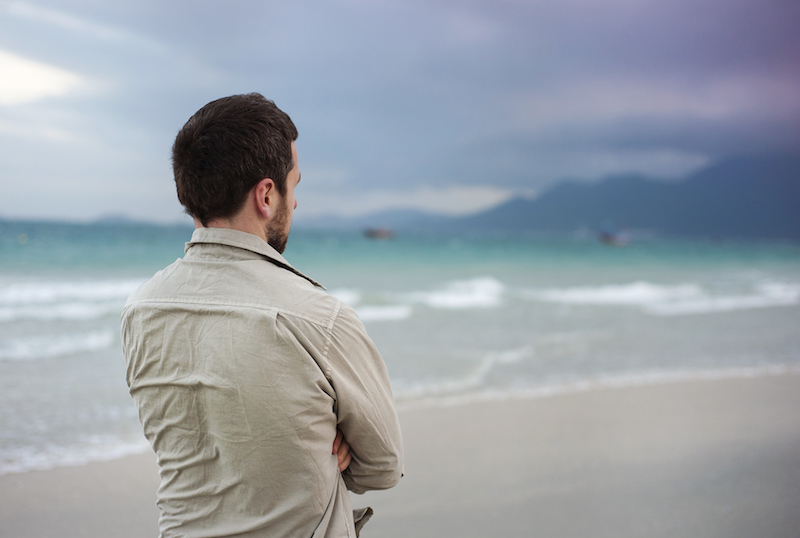 Divorce - Man walking on a beach